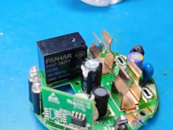 Smart Plug PCB with FANHAR Relay Close-up of a smart plug PCB with a FANHAR FH17-1A2TE relay and visible electronic components.