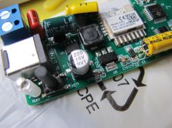 Close-up of a Circuit Board with Electronic Components Close-up of a circuit board with CBU module, buttons, and capacitors.