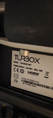 Tech label of TURBOX TXV-3240D SMT device Label on the back of TURBOX TXV-3240D SMT device showing model and power details