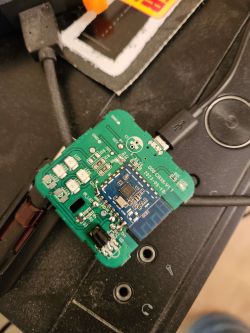Close-up of an electronic circuit mounted on a printed circuit board, connected by a USB cable.
