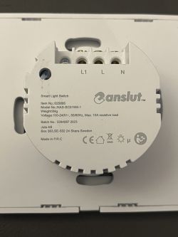 Back of Anslut Smart Wall Switch Back of Anslut smart wall switch with technical specifications and connection markings.