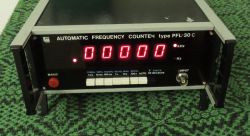 PFL-30 C frequency counter with red LED display and control switches on front panel