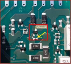 Printed Circuit Board with Damaged Resistor Close-up of a printed circuit board with a highlighted resistor.