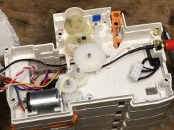 Inside the Tuya Energy Meter Interior of the Tuya 3-phase energy meter with visible gears and wiring.