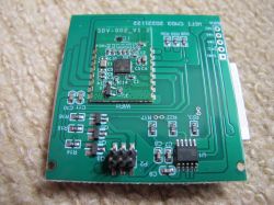 PCB board with a Wi-Fi module and electronic components on a green substrate.