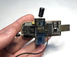 ESP8266 module connected to USB programmer with capacitor