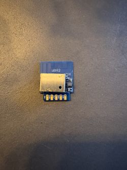 WBR2 electronic module on a dark background.