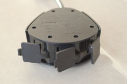 Bottom Part of Feit Electric Smart Plug Bottom part of the Feit Electric outdoor smart plug with three outlets, showing mounting screws.