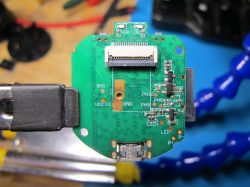 Close-up of a printed circuit board with visible traces and electronic components.