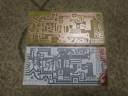 Two PCBs; etched board on top, printed circuit layout on bottom.