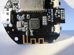 Round Printed Circuit Board with Electronic Components and Micro USB Port Close-up of a round printed circuit board with electronic components, micro USB port, and PCB antenna.