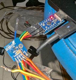 Connecting Electronic Device to USB Module Connected electronic device with colored wires and a USB module during soldering.