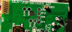 Close-up of DLX-USB-BK7231N 12V PCB PCB with DLX-USB-BK7231N 12V markings and test points.