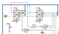 Fragment schematu elektronicznego z dwoma układami 74LS393, oznaczonymi jako U31 A i U31 B, oraz połączeniami do innych elementów logicznych.