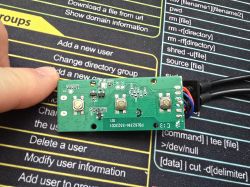 PCB with BK7231N label, three push buttons, and wires connected on the right