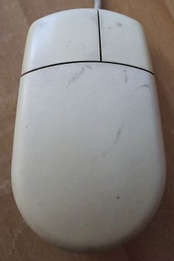 Old computer mouse for Amiga before refurbishment.