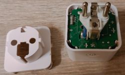 Disassembled Smart Wi-Fi Plug Disassembled smart Wi-Fi plug with exposed interior and circuit board.