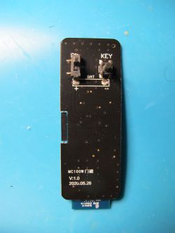 MC100W Circuit Board MC100W circuit board with buttons labeled KEY and BAT on a blue background.