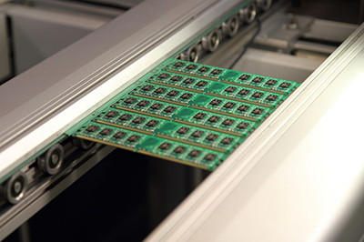 Printed Circuit Board on Production Line Printed circuit board (PCB) on a production line.