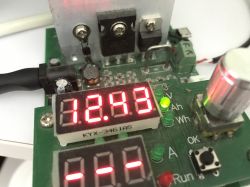 Test PCB with red 12.43 readout and LEDs next to labels V, Ah, and Wh