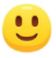 Yellow smiling face emoji with open eyes