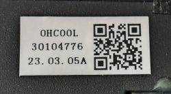 White label with QR code and text “OHCOOL 30104776 23.03.05A” on black plastic.