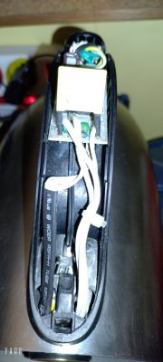 Interior of an electric kettle with visible electronic components.