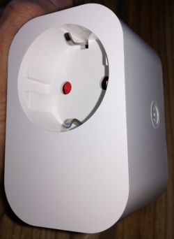 White Electrical Socket White electrical socket held in a hand.