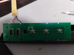 Circuit board with two USB-C ports and three buttons.