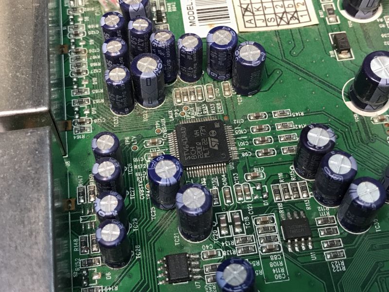 Close-up of capacitors and ST microchip on decoder PCB