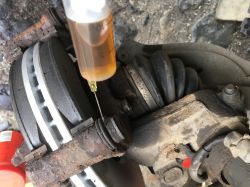 Unscrewing Screws from Brake Yoke: Step-by-Step Guide for Citroen Berlingo Brake Disc Replacement Unscrewing Screws from Brake Yoke: Step-by-Step Guide for Citroen Berlingo Brake Disc Replacement