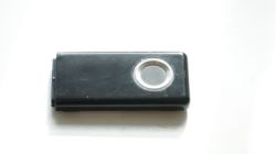 Black USB drive with a circular fingerprint sensor