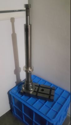 Metal structure mounted on a plastic crate.