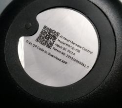 Sticker with information about AI Smart Remote Control on a black surface.