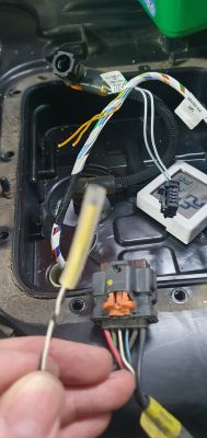Thermistor and Car Wiring Repair Car wiring repair with visible thermistor and electrical connectors.