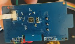 Circuit Board with CB3S Chip Circuit board with microprocessor, pin labels, and ribbon connector.