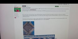 Computer screen showing a forum post about STM32 with a photo of a microcontroller on a board