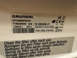 Tabliczka znamionowa suszarki Grundig GTN38267GCW z instrukcją czyszczenia filtra.