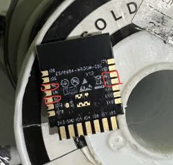 ESP8266 board with highlighted pins against a white rotor background.