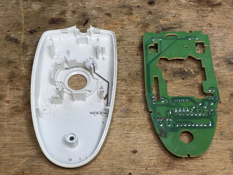 Interior of a Trekker Ball Mouse Interior of an old ball mouse, consisting of a casing and a circuit board.
