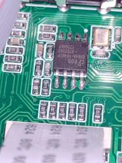 Close-up of a circuit board with an integrated circuit and electronic components.