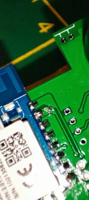 Close-up of a circuit board with a soldered module.