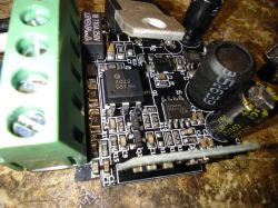 Photo of an electronic dimmer circuit board with various components.