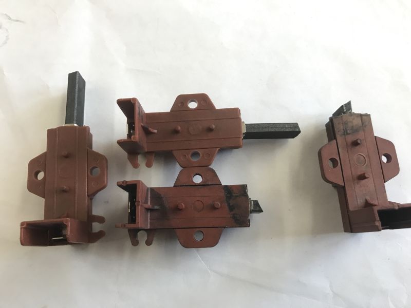 Comparison of old and new carbon brushes for a washing machine motor