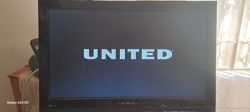 A CROWN-branded TV displaying the UNITED logo on the screen.