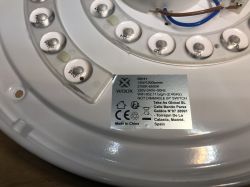 View of the Woox ceiling light with specification label.