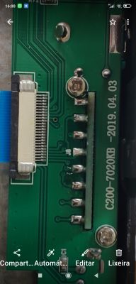 Image of a green circuit board with electronic components and markings.