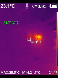 Thermal image of a battery cell with a local temperature rise up to 25.5°C against a background of about 23°C.