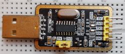 USB to UART Converter on Breadboard USB to UART converter on a breadboard with visible pins and components.