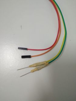 Close-up of colorful wires connected to test probes.